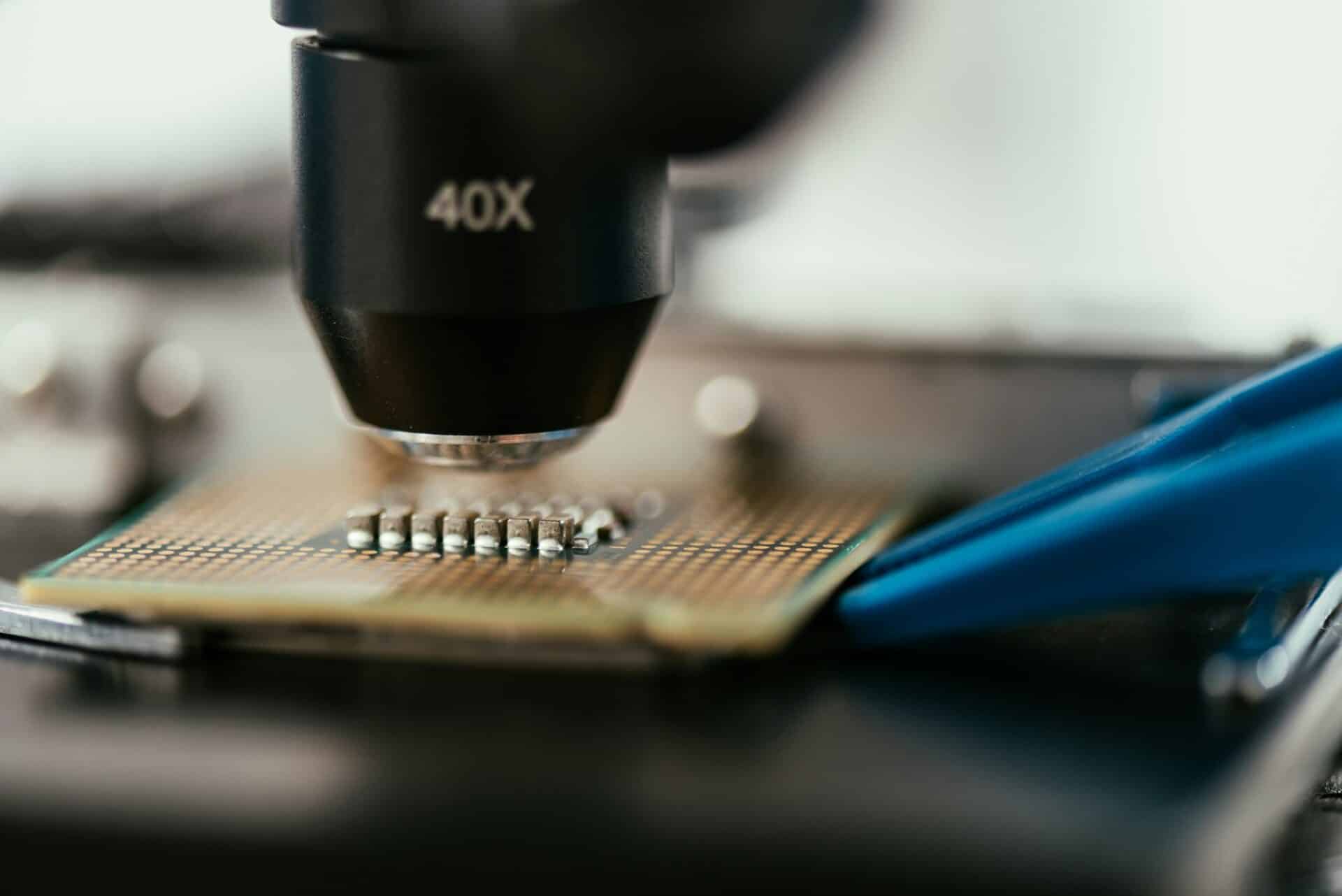 close up view of computer microchip under microscope