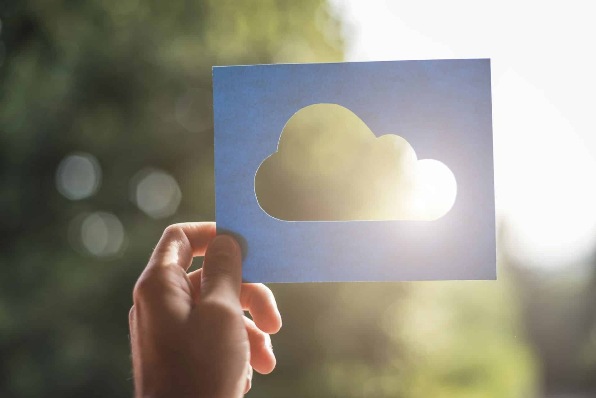 Hand holding cloud computing symbol